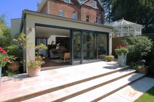 Glass box contemporary extension with a zinc roof